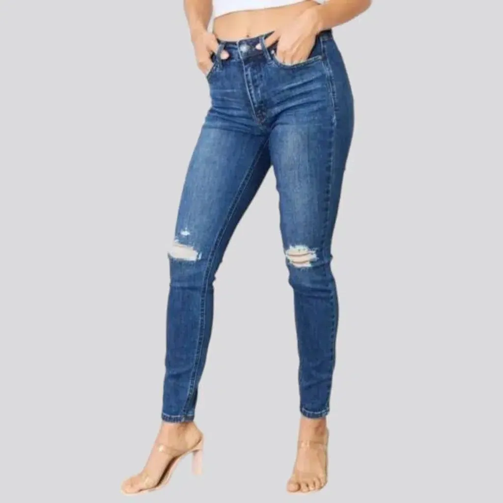 Distressed women's jeans